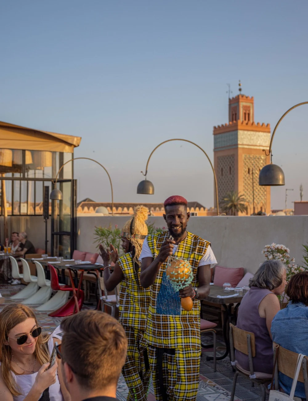 Live performance among guests on Coco Rooftop terrace in Marrakech