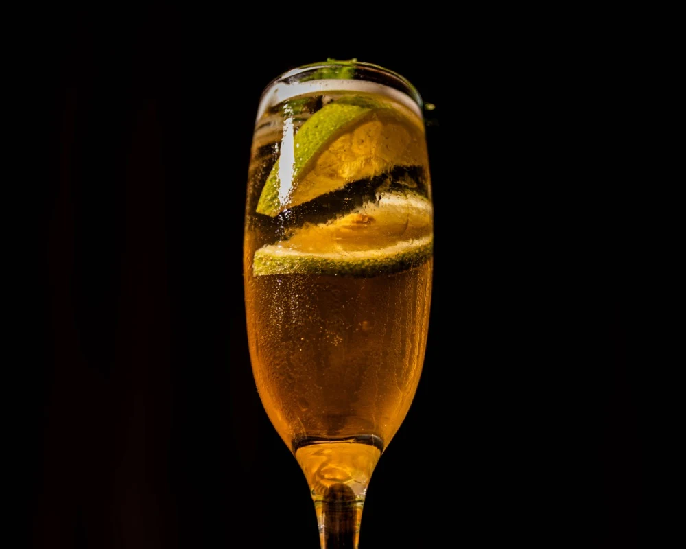 Glass of sparkling drink at dusk