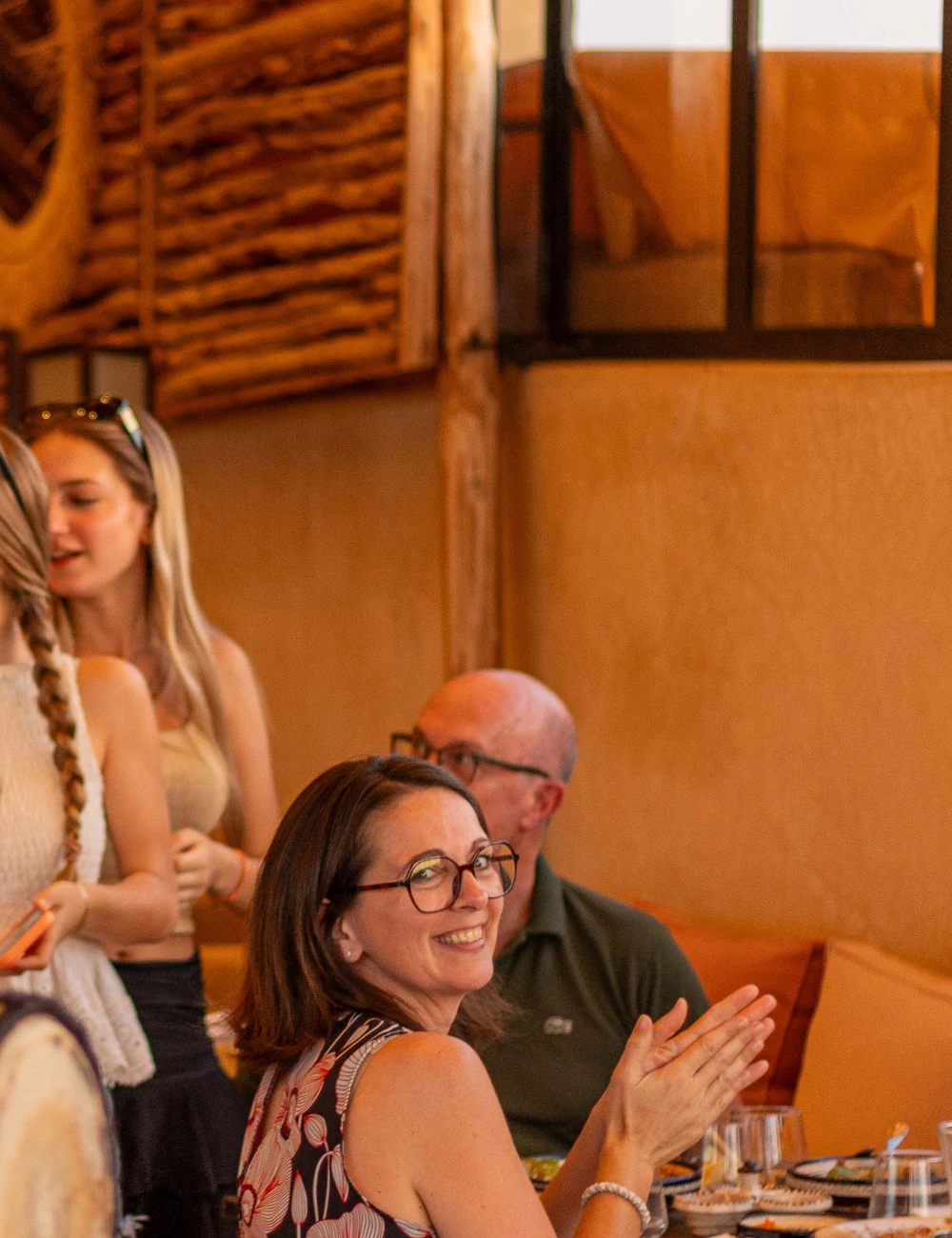 Happy guests applauding during an evening at Coco Rooftop
